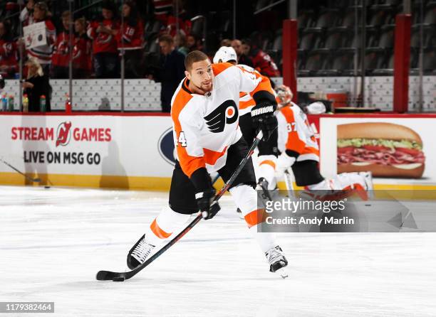 Chris Stewart of the Philadelphia Flyers takes a shot during warm ups prior to the game against the New Jersey Devils at the Prudential Center on...
