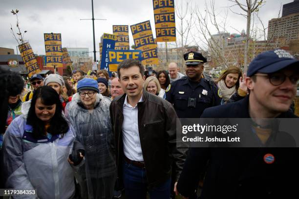 Democratic presidential candidate, South Bend, Indiana Mayor Pete Buttigieg walks with his husband Chasten Buttigieg before the Iowa Democratic Party...