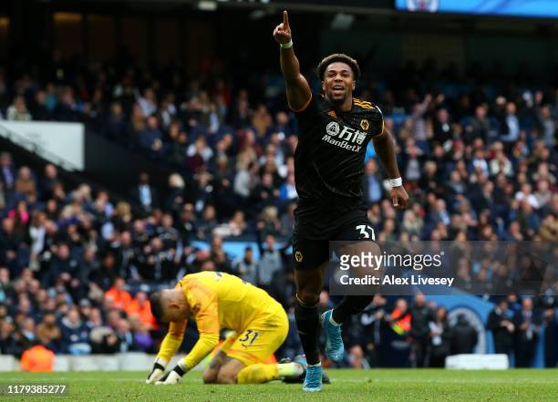 Adama Traore of Wolverhampton Wanderers celebrates after scoring his team's first goal during the Premier League match between Manchester City and...
