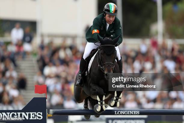 Cian O'Connor of Ireland rides PSG Final in the final competition during Day 4 of Longines FEI Jumping Nations Cup Final at Real Club de Polo de...