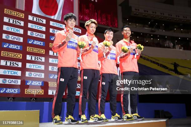 Shuhei Tada, Kirara Shiraishi, Yoshihide Kiryu and Abdul Hakim Sani Brown of Japan, bronze, pose during the medal ceremony for the Men's 4x100 Metres...
