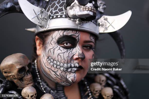 An Oakland Raiders fan poses for a photograph outside the stadium ahead of the game between Chicago Bears and Oakland Raiders at Tottenham Hotspur...