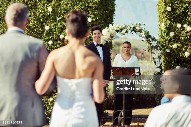 the moment he saw his bride for the first time - wedding ceremony aisle stock pictures, royalty-free photos & images