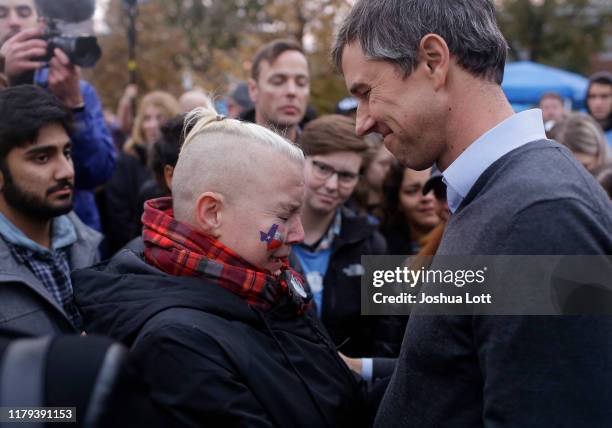 Democratic presidential candidate and former Rep. Beto O'Rourke speaks to volunteer Charlie Jordan as she tries to hold back tears after O'Rourke...