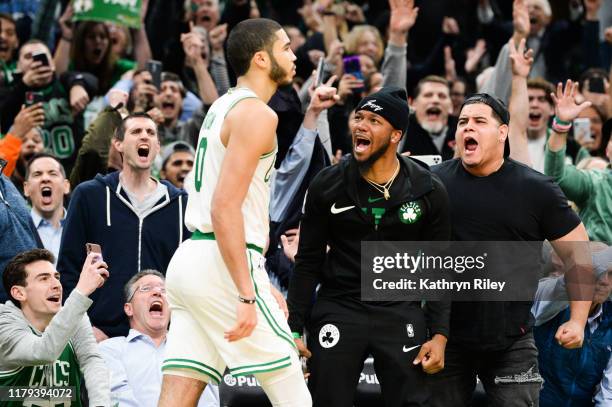 Fans react after Jayson Tatum of the Boston Celtics hit the game winning shot against the New York Knicks in the second half at TD Garden on November...