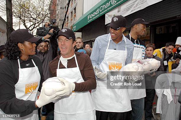 Dennis Quaid and Jerome Williams during Dennis Quaid and the New York Knicks Visit the FoodChange Community Kitchen in New York City - November 21,...