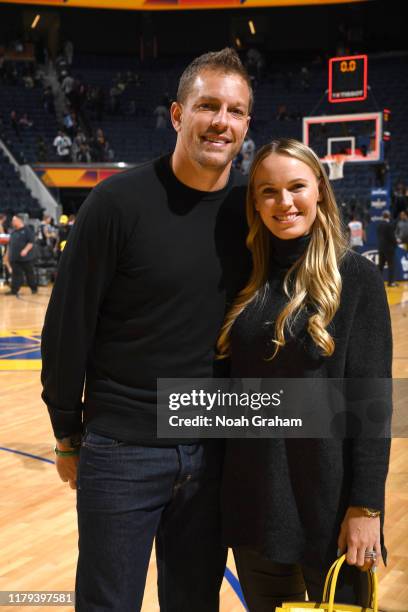 Former NBA player David Lee and tennis player Caroline Wozniacki smile for a photo after a game between the Golden State Warriors and the San Antonio...