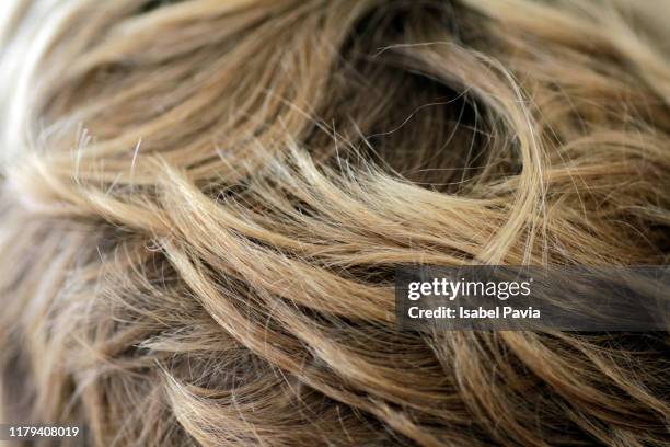 close up shot of wavy blond hair - hair texture stock pictures, royalty-free photos & images