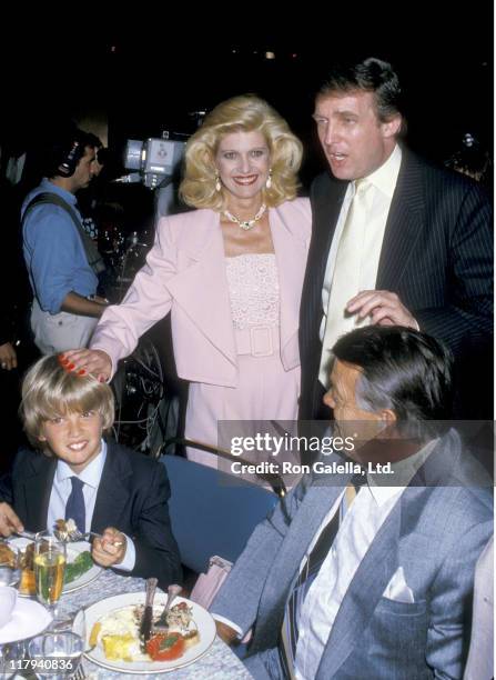 View of, from left, Donald Trump Jr , his parents Ivana Trump & Donald Trump , and Milos Zelnicek , as they attend a boxing match at Trump Plaza,...