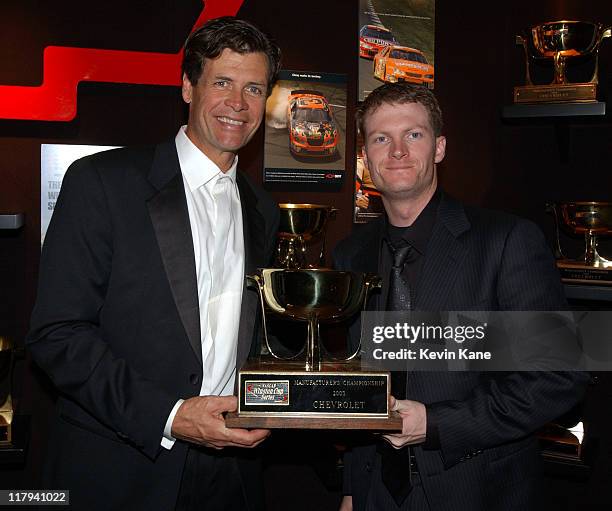 Winston Cup driver Michael Waltrip poses with DEI teammate, Dale Earnhardt Jr.and the 2003 Chevrolet Manufacturer's Championship trophy