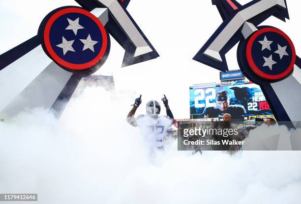 Derrick Henry of the Tennessee Titans points up while walking onto the field before the game against the Buffalo Bills at Nissan Stadium on October...