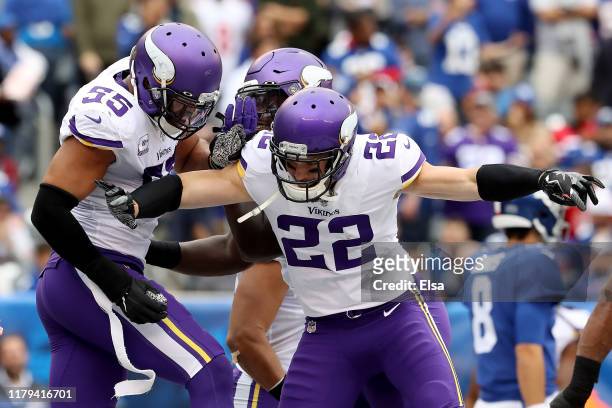Anthony Barr of the Minnesota Vikings celebrates with Harrison Smith after tackling Jon Hilliman of the New York Giants in the end zone for a safety...