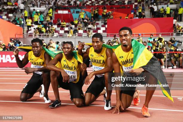 Akeem Bloomfield, Nathon Allen, Terry Ricardo Thomas, and Demish Gaye of Jamaica celebrate winning silver in the Men's 4x400 metres relay final...