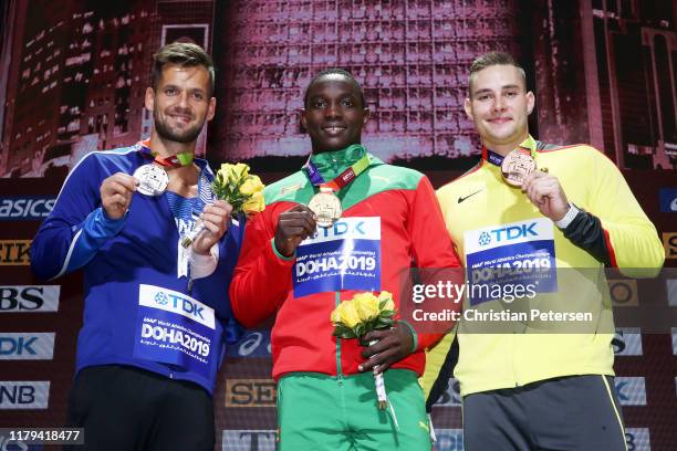 Silver medalist Magnus Kirt of Estonia, gold medalist Anderson Peters of Grenada and bronze medalist Johannes Vetter of Germany stand on the podium...