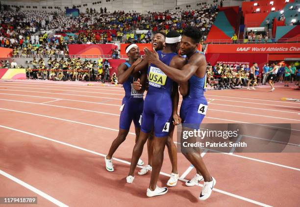 Fred Kerley, Michael Cherry, Wilbert London, and Rai Benjamin of the United States celebrate winning gold in the Men's 4x400 metres relay final...