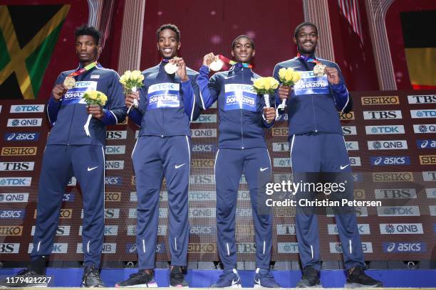 Fred Kerley, Michael Cherry, Wilbert London, and Rai Benjamin of the United States stand on the podium for the medal ceremony after winning gold in...