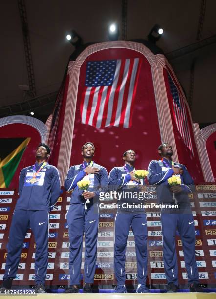 Fred Kerley, Michael Cherry, Wilbert London, and Rai Benjamin of the United States stand on the podium for the medal ceremony after winning gold in...