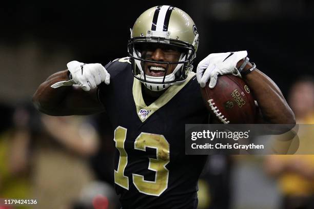 Michael Thomas of the New Orleans Saints reacts after scoring a touchdown against the Tampa Bay Buccaneers at Mercedes Benz Superdome on October 06,...