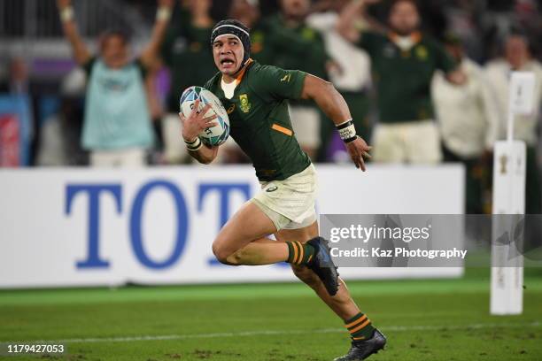 Cheslin Kolbe of South Africa scores his team's second try during the Rugby World Cup 2019 Final between England and South Africa at International...