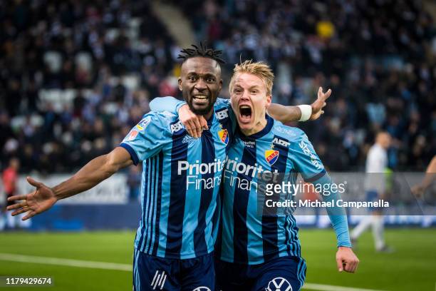 Buya Turay of Djurgardens IF celebrates scoring the equalising goal to make it 2-2 and help win the league with teammate Elliot Kack during the...