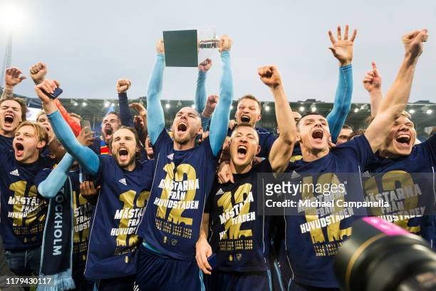 Djurgardens IF captain Marcus Danielson raises the Lennart Johansson trophy after Djurgardens IF wins the 2019 Allsvenskan season during an...