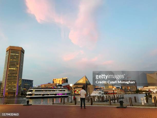 sunset at baltimore inner harbor - baltimore waterfront stock pictures, royalty-free photos & images