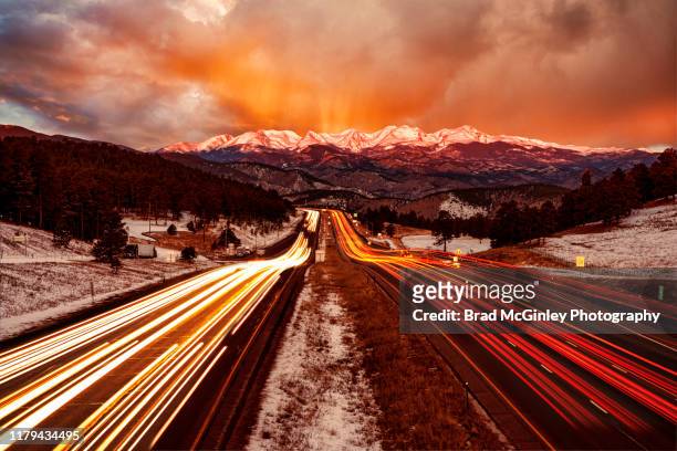 front range sunrise from i-70 traveling - front range mountain range bildbanksfoton och bilder