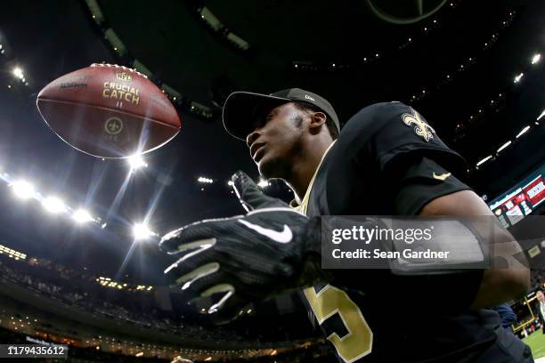 Teddy Bridgewater of the New Orleans Saints runs off the field after his team defeated the Tampa Bay Buccaneers 31 - 24 at the Mercedes Benz...