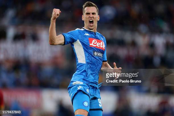 Arkadiusz Milik of SSC Napoli celebrates after scoring his team's first goal during the Serie A match between AS Roma and SSC Napoli at Stadio...