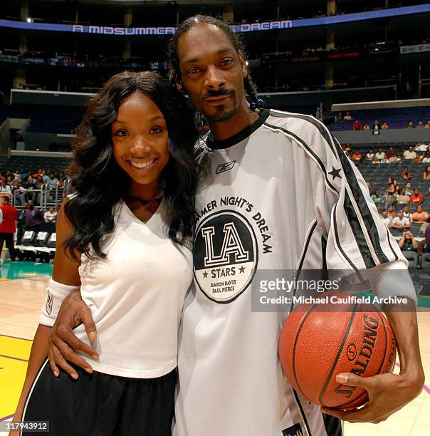 Brandy and Snoop Dogg pose before A Midsummer Night's Dream Celebrity and All-Star Basketball Game on July 9, 2006 at the Staples Center in Los...