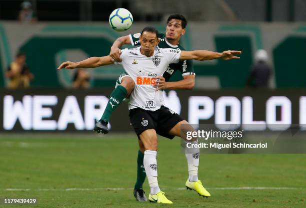 Gustavo Gomez of Palmeiras vies the ball with Ricardo Oliveira of Atletico MG during a match between Palmeiras and Atletico MG for the Brasileirao...