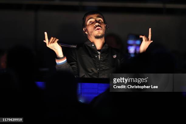 Singer AJ Tracey performs at half time during the game between Chicago Bears and Oakland Raiders at Tottenham Hotspur Stadium on October 06, 2019 in...