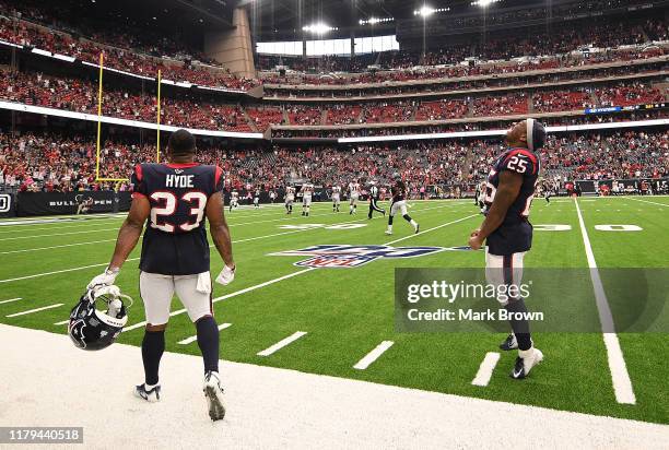 Carlos Hyde and Duke Johnson of the Houston Texans celebrate an interception returned for a touchdown by Tashaun Gipson in the foruth quarter against...