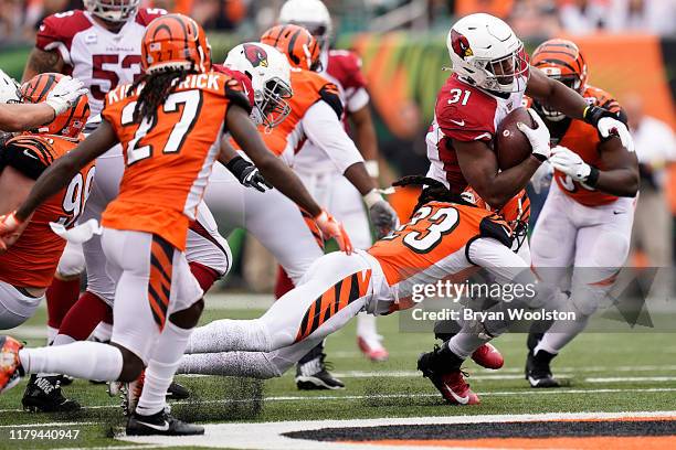 David Johnson of the Arizona Cardinals is tackled by B.W. Webb of the Cincinnati Bengals during the NFL football game at Paul Brown Stadium on...