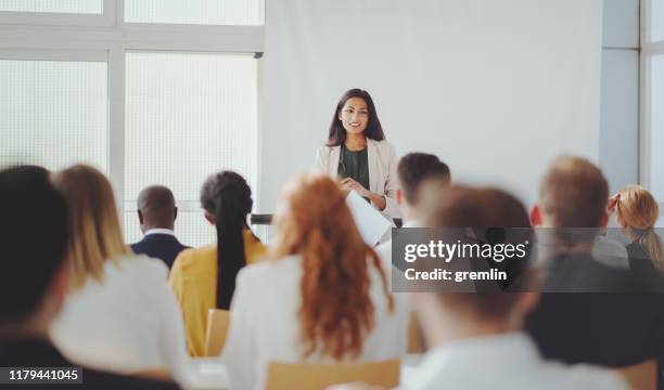indian businesswoman leading the seminar - slide show stock pictures, royalty-free photos & images