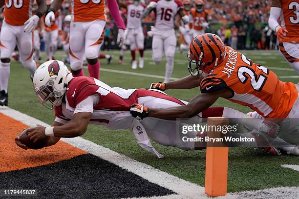 Kyler Murray of the Arizona Cardinals dives into the end zone for a touchdown during the first quarter of the NFL football game against the...