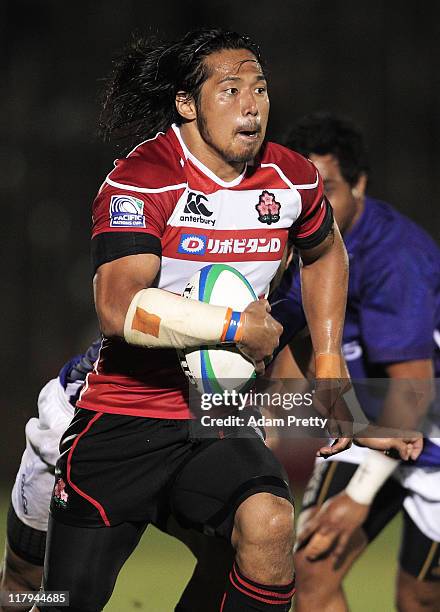 Kosuke Endo of Japan makes a break during the IRB Pacific Nations Cup match between Japan and Samoa at Prince Chichibu Memorial Stadium on July 2,...