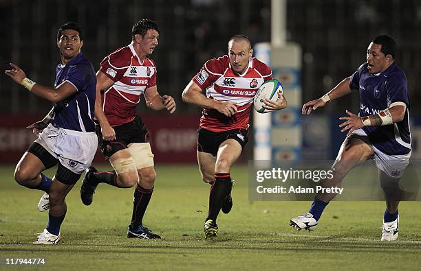 Shaun Webb of Japan makes a break during the IRB Pacific Nations Cup match between Japan and Samoa at Prince Chichibu Memorial Stadium on July 2,...