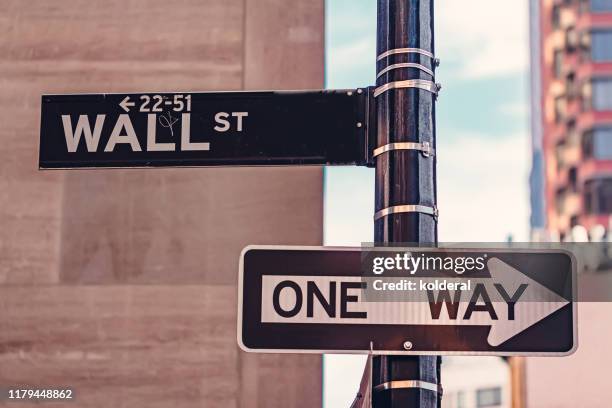 wall street sign, one way traffic sign - one way stock pictures, royalty-free photos & images