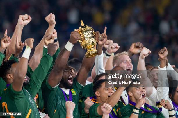 South Africa captain Siya Kolisi lifts the trophy with his team mates Faf de Klerk Herschel Jantjies and Cheslin Kolbe after the Rugby World Cup 2019...