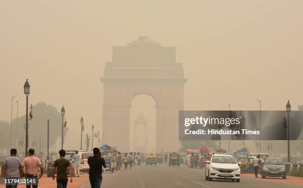 The India Gate monument engulfed in smog at Rajpath, on November 2, 2019 in New Delhi, India. Air quality oscillated between the severe 400 and 500...