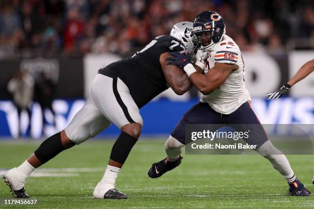 Trent Brown of Oakland Raiders collides with Khalil Mack of Chicago Bears during the game between Chicago Bears and Oakland Raiders at Tottenham...