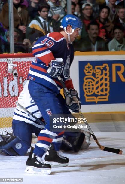 Kent Mandeville of the Edmonton Oilers skates against the Toronto Maple Leafs during NHL game action on December 23, 1995 at Maple Leaf Gardens in...