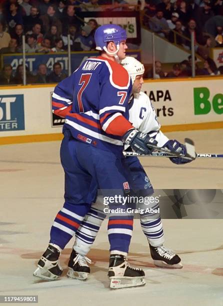 Jason Arnott of the Edmonton Oilers skates against Doug Gilmour of the Toronto Maple Leafs during NHL game action on December 23, 1995 at Maple Leaf...