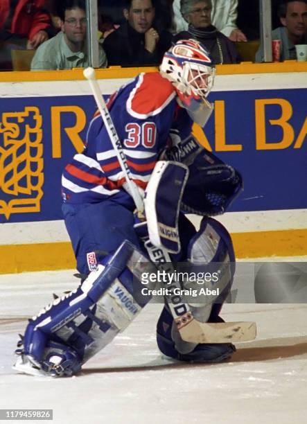 Bill Ranford of the Edmonton Oilers skates against the Toronto Maple Leafs during NHL game action on December 23, 1995 at Maple Leaf Gardens in...