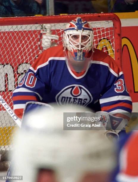 Bill Ranford of the Edmonton Oilers skates against the Toronto Maple Leafs during NHL game action on December 23, 1995 at Maple Leaf Gardens in...