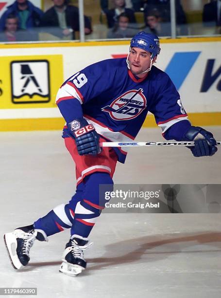 Darren Turcotte of the Winnipeg Jets skates against the Toronto Maple Leafs during NHL game action on November 18, 1995 at Maple Leaf Gardens in...