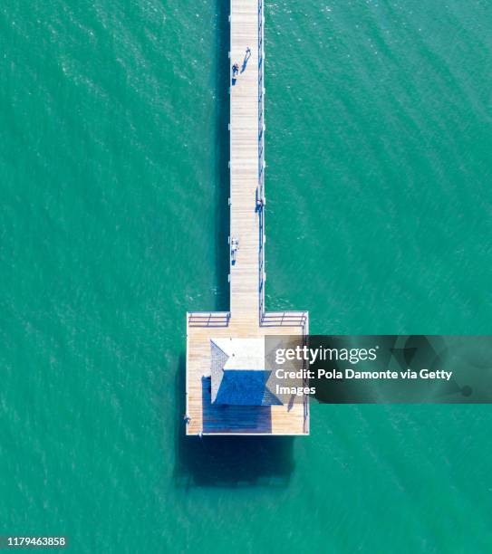 aerial top point of view of naples pier and calm ocean, florida - nápoles florida fotografías e imágenes de stock