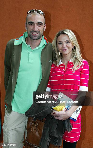 Jerome Alonso and his wife pose in the 'Village', the VIP area of the French Open at Roland Garros arena in Paris, France on June 1, 2007.