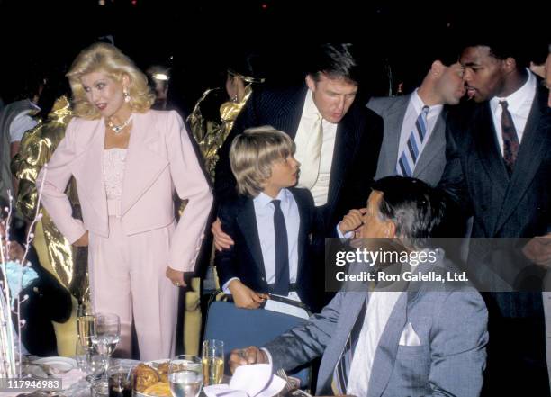 View of, from left, Ivana Trump , her son, Donald Trump Jr , and husband, Donald Trump, Milos Zelnicek , and Herschel Walker as they attend a boxing...